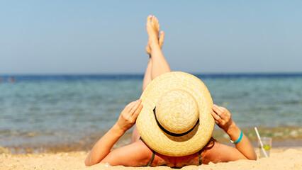 Painting woman sunbathing on the beach