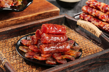 Chinese Air-Dried Sausages and Cured Meats on Bamboo Tray - Traditional Asian Charcuterie Display