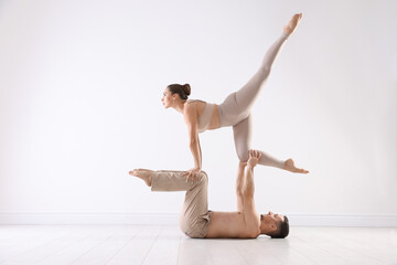 Couple of professional dancers training in studio