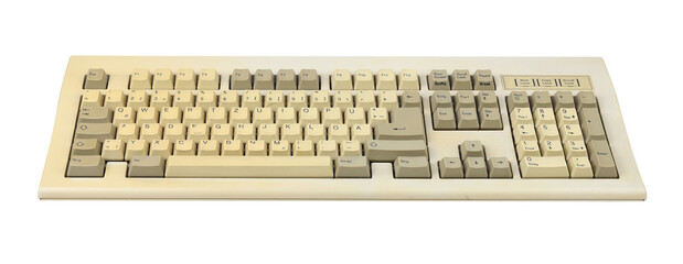 Vintage computer keyboard from the 1990s isolated on white background.