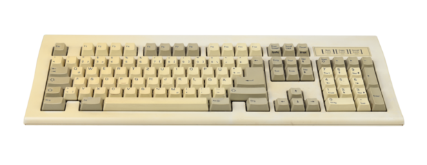 Vintage computer keyboard from the 1990s isolated on white background.