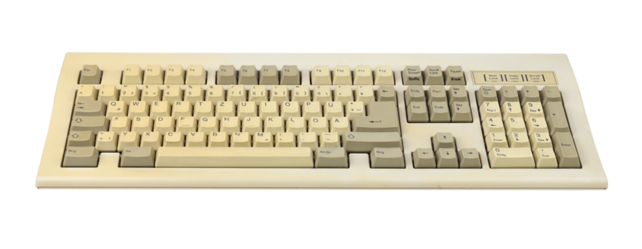 Vintage computer keyboard from the 1990s isolated on white background.