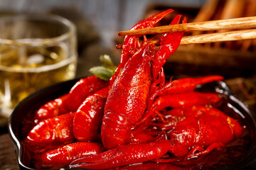 Spicy Red Cooked Crayfish Chinese Seafood Dish with Chopsticks and Beer