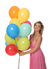 Smiling woman in dress with bunch of colorful balloons on white background