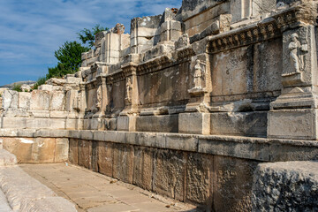 Fototapeta premium A wall of a building with reliefs and ornaments in the ancient city of Sagalassos in the Aglasun district of Burdur province in Turkey