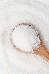 Fine White Sugar Crystals in Wooden Spoon - Sweet Edible Granules for Cooking and Baking