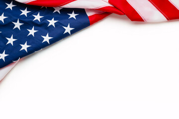 A U.S. flag with its stars and stripes is draped against a clean white background, symbolizing patriotism and national holidays like Labor Day