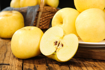 Fresh Golden Yellow Apples on Rustic Wood - Organic Fruit Harvest Display