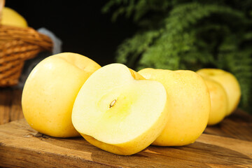 Fresh Golden Fuji Apples Sliced on Wooden Board - Healthy Organic Fruit Kitchen Scene