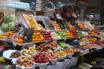  Bazaar in Dushanbe with stalls with fruits and wicker baskets