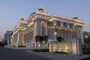 Obraz premium Dushanbe, Tajikistan - Scenery of center of Dushanbe, capital of Tajikistan. New building of the Parliament of Tajikistan with evening illuminations.