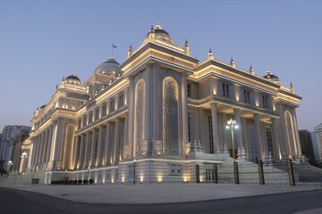 Fototapeta premium Dushanbe, Tajikistan - Scenery of center of Dushanbe, capital of Tajikistan. New building of the Parliament of Tajikistan with evening illuminations.