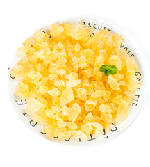 Large Golden Cane Sugar Crystals in Decorative Bowl with Fresh Mint Leaf