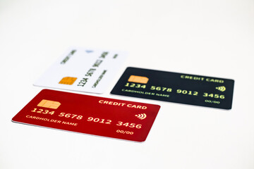 Isolated close-up of three credit cards with chip on a white background depicting financial security