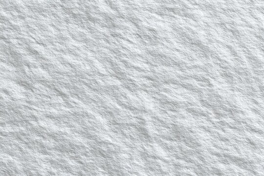 Close-up view of a textured, light gray stone surface