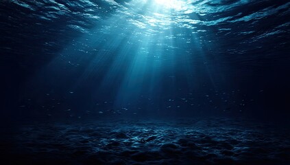 Underwater scene, sunbeams piercing deep blue water