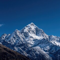 Majestic snow-capped mountain peak against a vibrant blue sky (1)