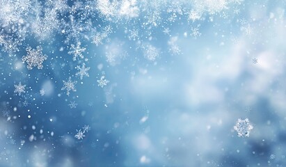 Fototapeta premium Falling snowflakes against a soft blue background
