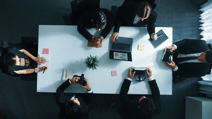 Top view of professional businessman give vr headset to diverse investors while young businesswoman looking at data analysis or marketing statistic on laptop and prepare for data sharing. Directorate.