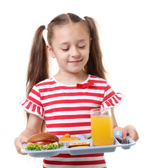 Little girl with tray of tasty food on white background
