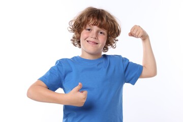 Strength. Happy little boy showing his biceps and thumbs up on white background