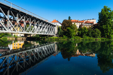 View of bridge to Old Town in Novo Mesto Slovenia at Riverside of Krka River.
