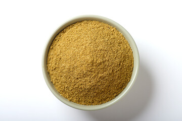 Indian food spice called coriander powder isolated on white background 