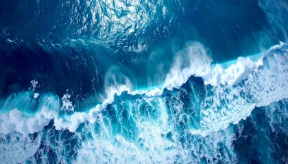 Breathtaking aerial view of powerful ocean waves crashing, showcasing the deep blue water and foamy white surf, a dynamic natural spectacle