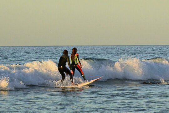 Surfers riding the waves at Playa de Canallave, Santander, Spain.
August 02 , 2025
 Dynamic action shot of surfing on the Cantabrian coast, popular beach for water sports and summer tourism