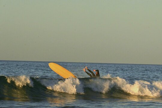 Surfers riding the waves at Playa de Canallave, Santander, Spain.
August 02 , 2025
 Dynamic action shot of surfing on the Cantabrian coast, popular beach for water sports and summer tourism. - Powered by Adobe
