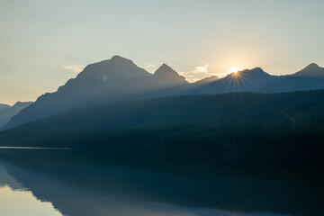 Layers Of Shadows Across Bowman Lake When Sun Bursts Over Distant Range