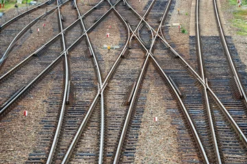 Fotobehang Spoorlijn intersection of many railway tracks  © lumofoto