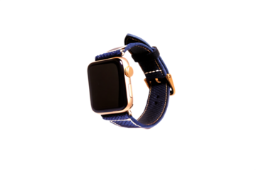 Gold smartwatch with blue fabric strap isolated on a transparent background image