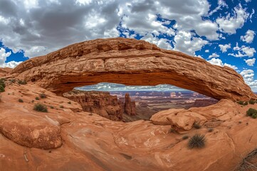 Canyonlands Mesa Arch scenic vista, dramatic sky