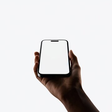A person is holding a white iPhone in their hand