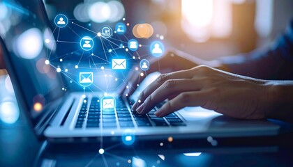 Hands typing on laptop with email network graphic