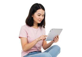 Fototapeta premium A young Asian woman sitting cross-legged, happily engaging with a tablet on a transparent background