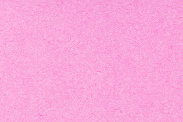 Pink textured paper background. Full frame