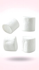 Four Marshmallows in Mid-Air Against White Background.