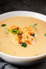 Tom kha soup shrimp, coconut milk, miso paste tasty seafood snack fresh delicious gourmet food background on the table rustic food top view copy space pescetarian diet