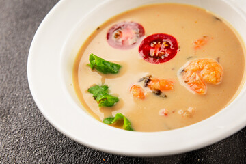 Tom kha soup shrimp, coconut milk, miso paste tasty seafood snack fresh delicious gourmet food background on the table rustic food top view copy space pescetarian diet