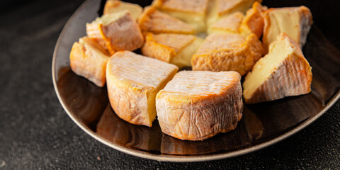 Cheese plate camembert, brie, munster french cheese tasty snack fresh delicious gourmet food background on the table rustic food top view copy space