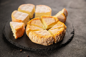 Cheese plate camembert, brie, munster french cheese tasty snack fresh delicious gourmet food background on the table rustic food top view copy space