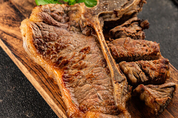 t-bone steak roast cut of meat juicy roast beef tasty snack fresh delicious gourmet food background on the table rustic food top view copy space