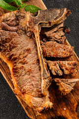 t-bone steak roast cut of meat juicy roast beef tasty snack fresh delicious gourmet food background on the table rustic food top view copy space