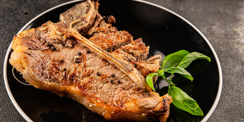 t-bone steak roast cut of meat juicy roast beef tasty snack fresh delicious gourmet food background on the table rustic food top view copy space