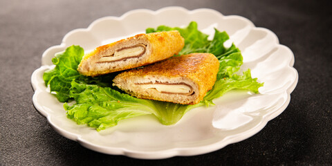 Cutlet cordon bleu meat chicken, cheese, ham second course french cuisine tasty snack fresh delicious gourmet food background on the table rustic food top view copy space