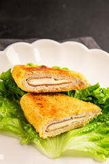 Cutlet cordon bleu meat chicken, cheese, ham second course french cuisine tasty snack fresh delicious gourmet food background on the table rustic food top view copy space