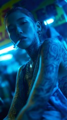 Model smoking a cigarette under striking blue neon lights, highlighting intricate tattoos and bold jewelry, creating a captivating and edgy atmosphere filled with urban allure