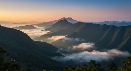 Obraz premium Majestic mountain peaks rise above a serene sea of clouds during a stunning golden sunrise, illuminating the vast, tranquil landscape
